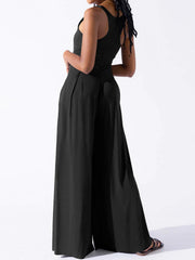 Black square neck palazzo jumpsuit with wide legs and a sleeveless design.