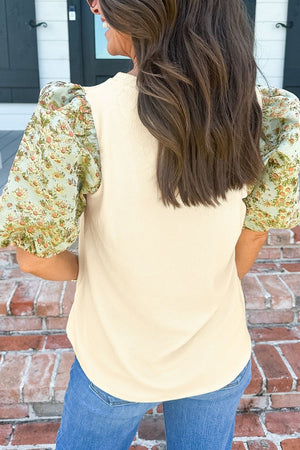 Beige ribbed knit top with floral puff sleeves