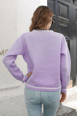 Lavender knit sweater with white stripes on cuffs and hem, crew neck, long sleeves.