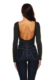 Black ribbed long sleeve bodysuit with deep scoop open back, paired with dark wash jeans.