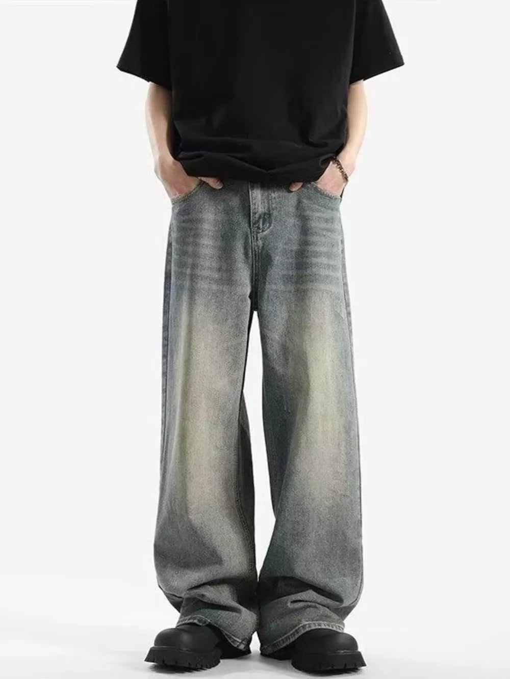 Men's relaxed fit vintage wash baggy jeans in light blue cotton blend.