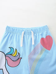 Light blue cotton shorts with unicorn and rainbow heart print, elastic waistband with drawstring.