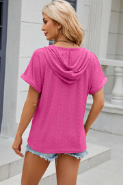 Hot Pink perforated henley hooded tee with short sleeves and a relaxed fit.