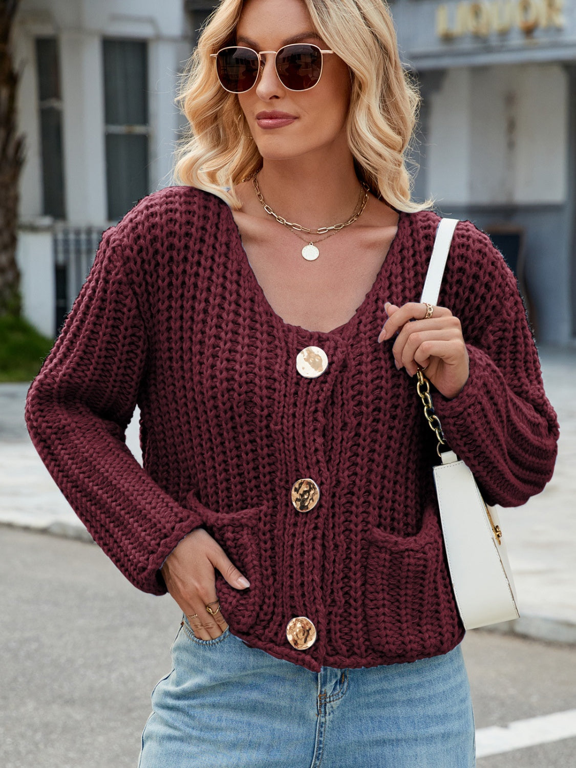 Burgundy chunky knit cardigan with gold buttons and pockets