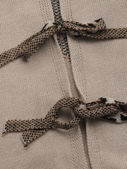Knit cardigan in gray apricot with patterned tie details at the neckline and waist.