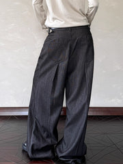 Men's black wide leg sweatpants with decorative buttons and back pockets.