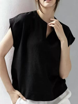 Black cap sleeve shirt with notched neckline and relaxed fit.