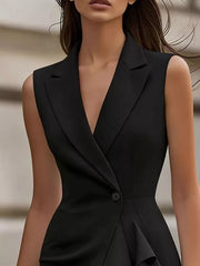 Black lapel collar sleeveless dress with cascading ruffles and a single button closure.