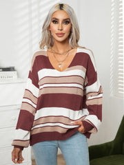 Wide stripe V-neck knit sweater in wine and tan acrylic with relaxed fit.