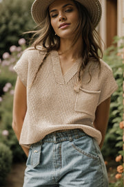Textured knit pocket top in khaki with V-neck and short sleeves.
