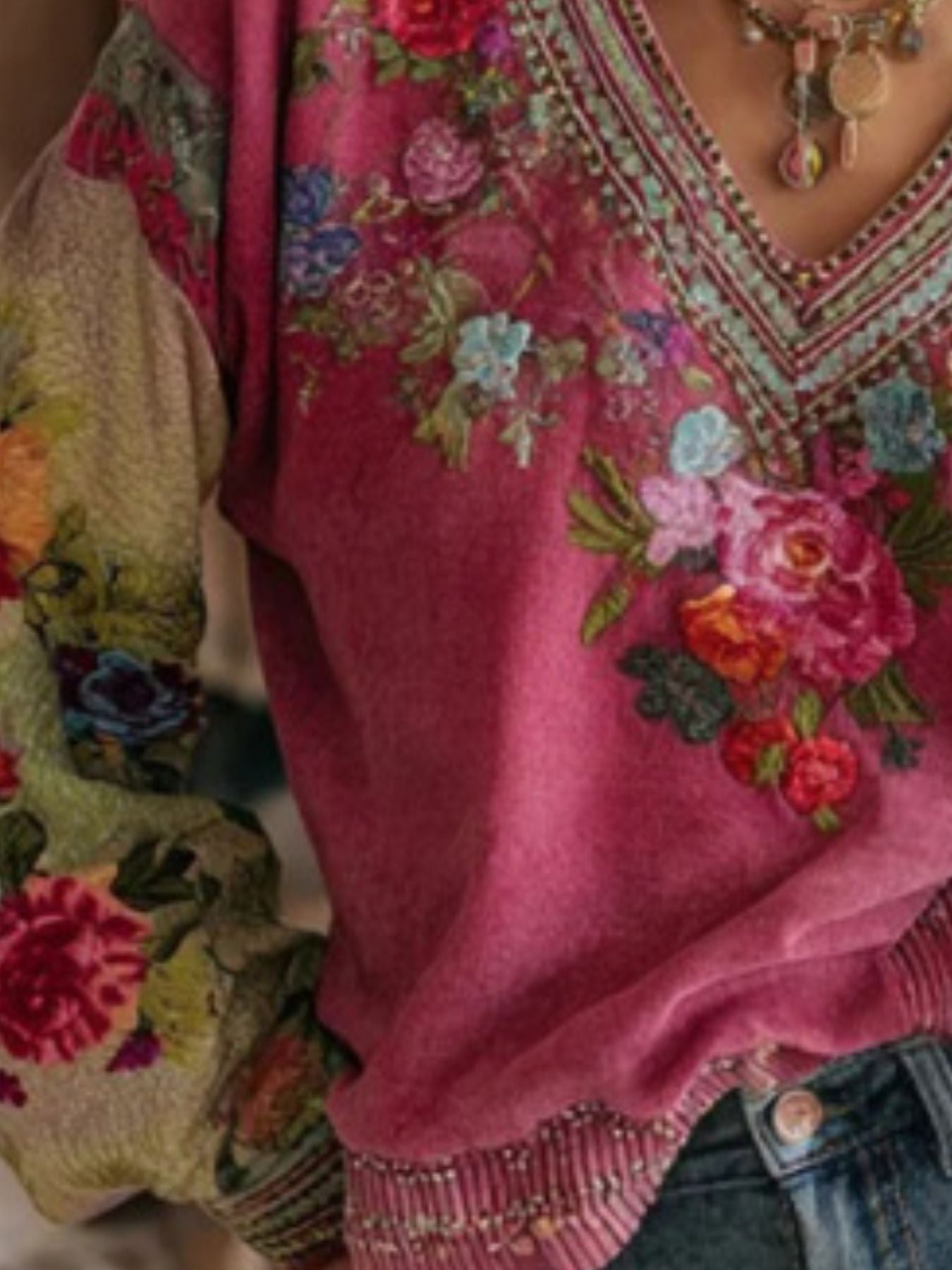 Embroidered deep rose V-neck blouse with floral detail and contrast printed sleeves.