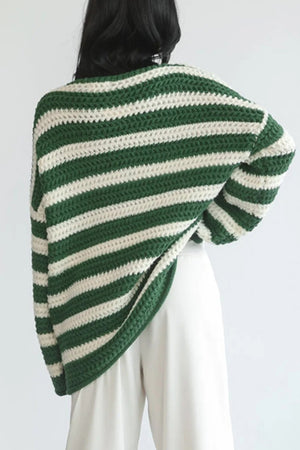 Green and cream striped boat neck knit sweater with chunky texture.