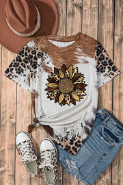 Cowhide sunflower graphic t-shirt with leopard print sleeves and hem.