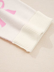Bow print drop shoulder sweater in beige acrylic blend with ribbed cuffs.