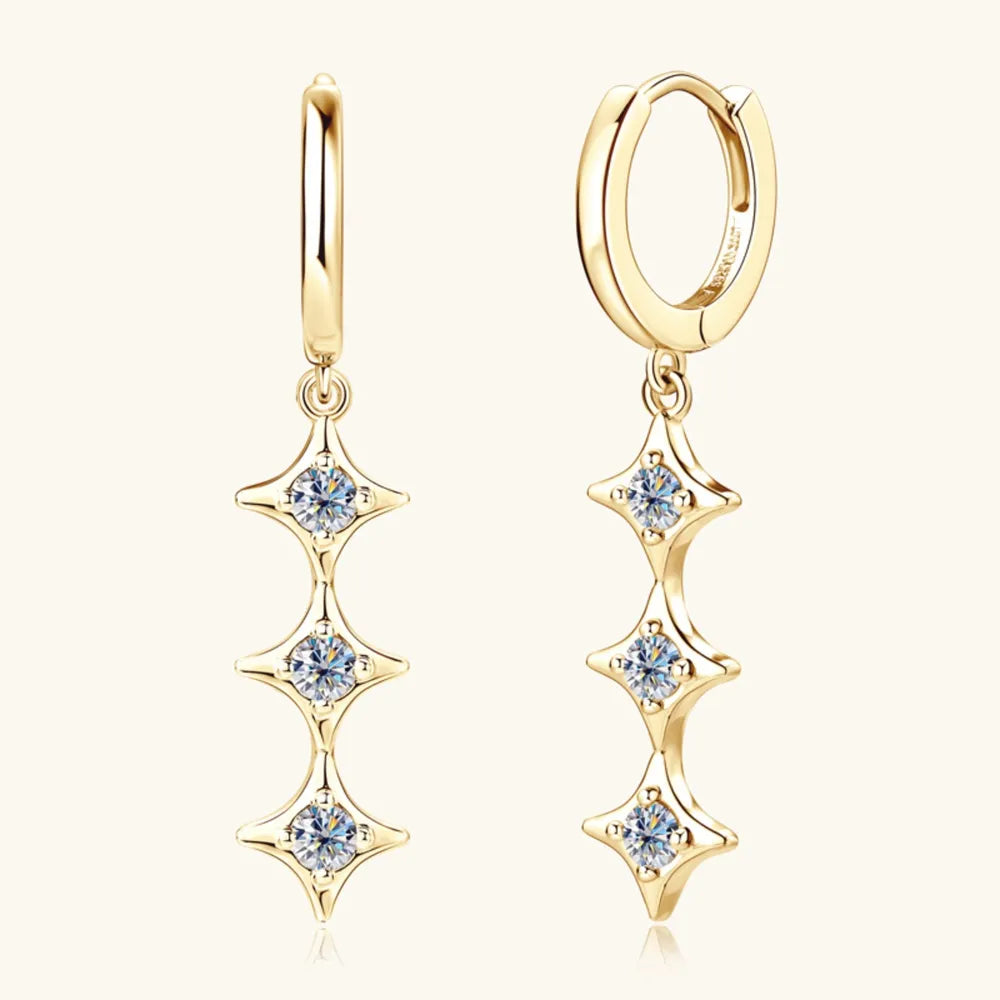 Gold hoop earrings with cascading star-shaped moissanite accents.