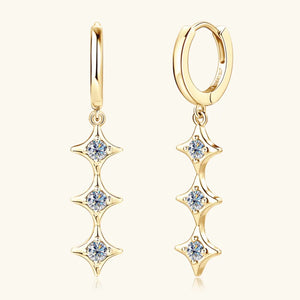 Gold hoop earrings with cascading star-shaped moissanite accents.