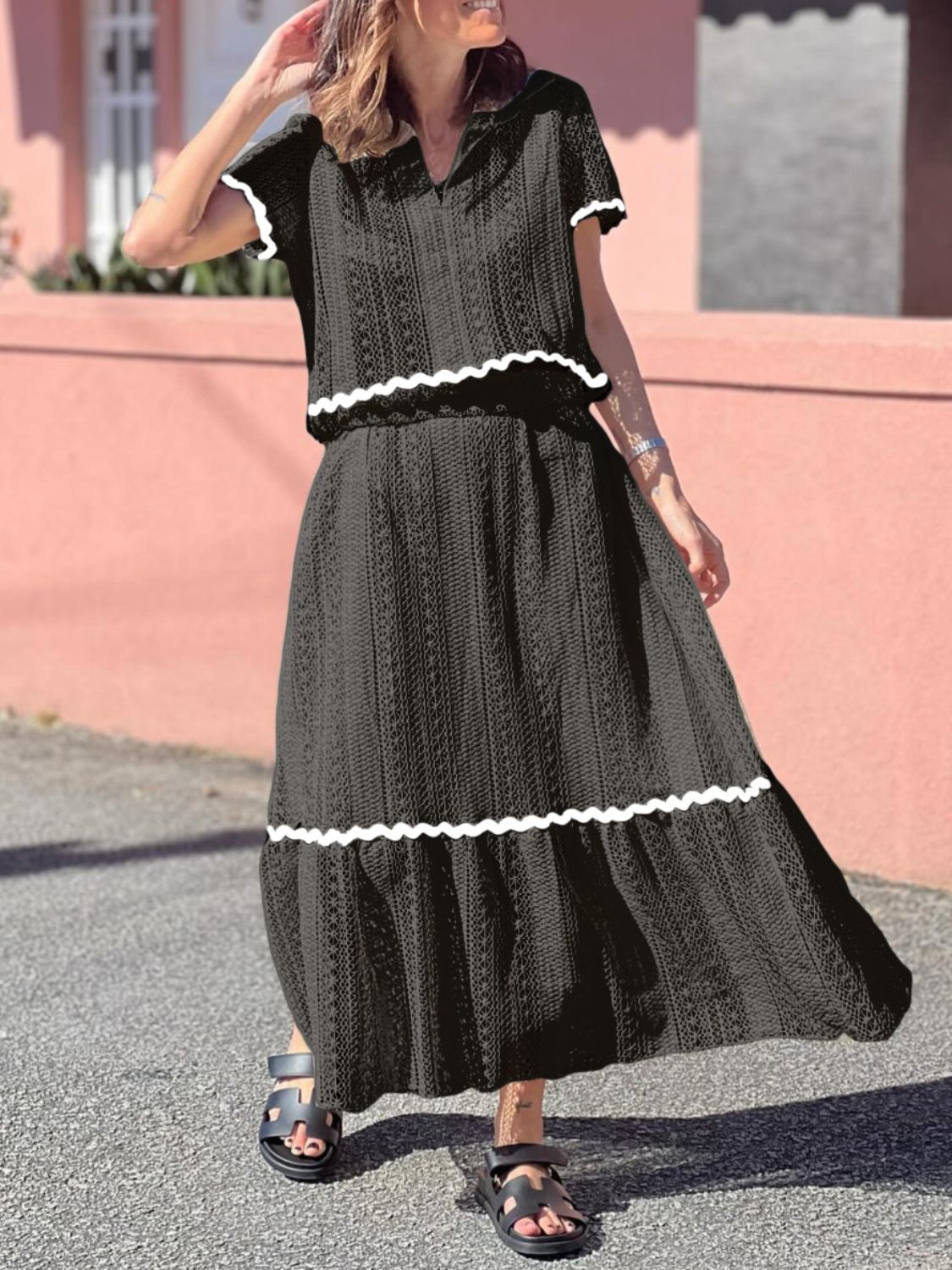 Black crochet co-ord set with scalloped trim and short sleeves, midi skirt.