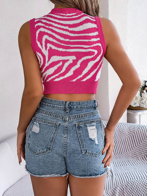 Hot pink zebra knit crop top with keyhole detail and ribbed trim.