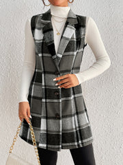 Black plaid sleeveless blazer dress with button front and notched lapels.