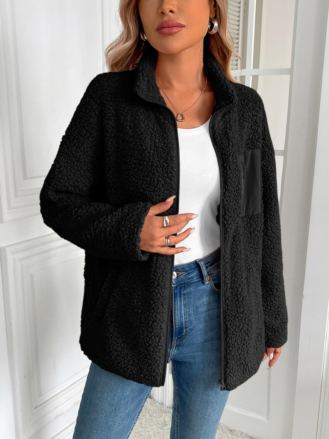 Black teddy fleece jacket with zip front and patch pocket detail