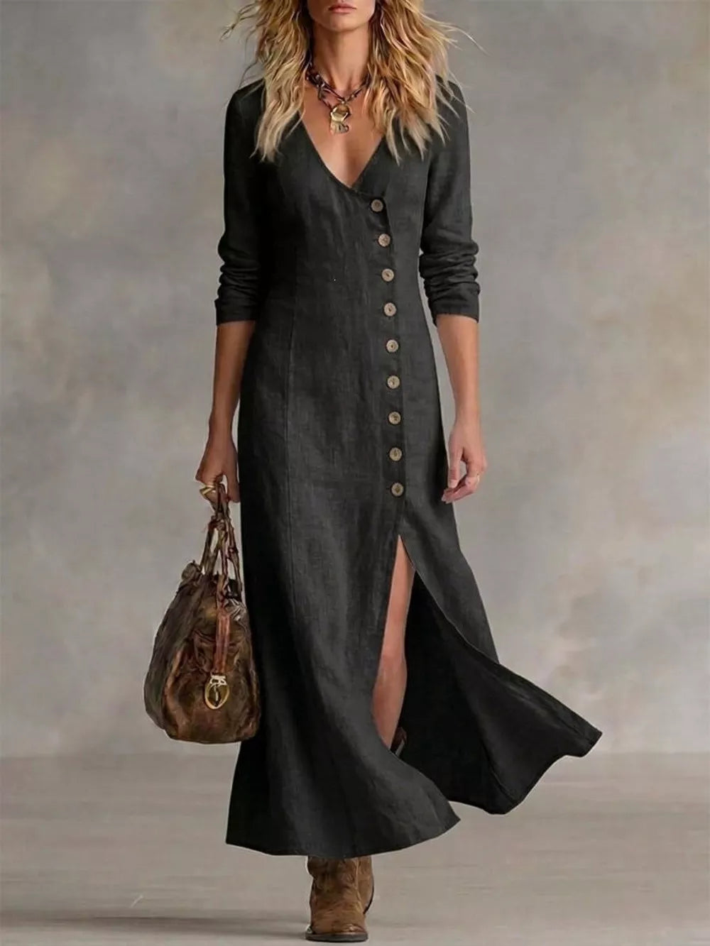 Black V-neck buttoned maxi dress with a high slit and long sleeves.