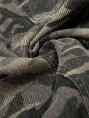 Men's cotton cargo pants in urban camouflage pattern, close-up detail.