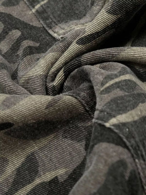 Men's cotton cargo pants in urban camouflage pattern, close-up detail.