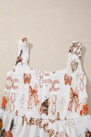 White cotton blend midi dress with cowboy-themed print, smocked bodice, and U-neck.