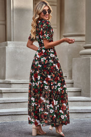 Black floral maxi dress with puff sleeves and tiered skirt.
