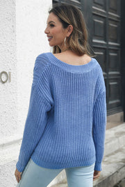 Blue relaxed V-neck cable knit acrylic jumper with ribbed details.
