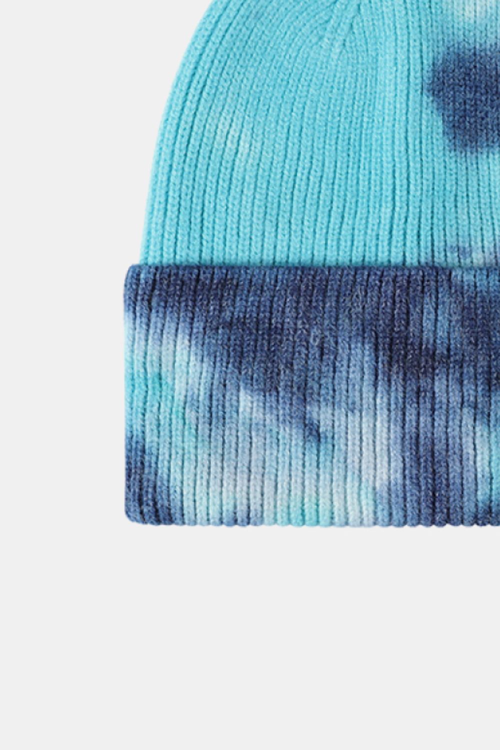 Ribbed knit beanie in sky blue with navy dip-dye pattern