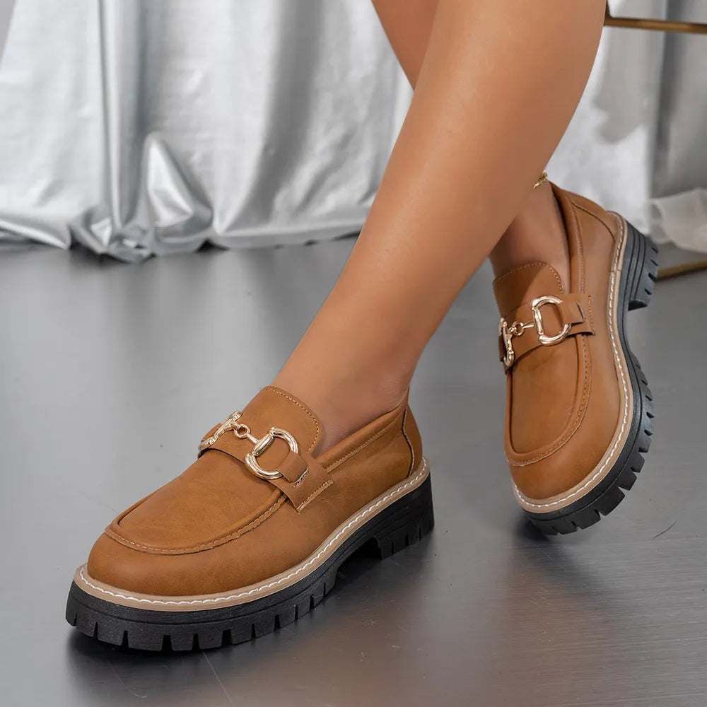 Terracotta chunky chain detail platform loafers with gold hardware.
