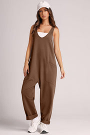 Relaxed fit chocolate jumpsuit with oversized pockets and cuffed ankles.