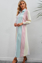 Vertical stripe shirtdress with collared neck and smocked cuffs.