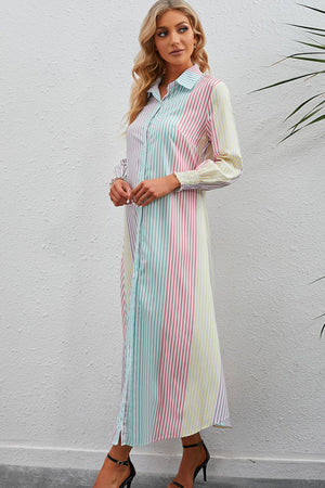 Vertical stripe shirtdress with collared neck and smocked cuffs.