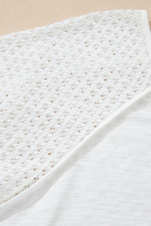 White lace-inset dolman sleeve blouse with a textured knit fabric detail.