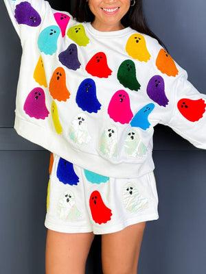 White loungewear set with colorful ghost appliqués and iridescent ghosts.