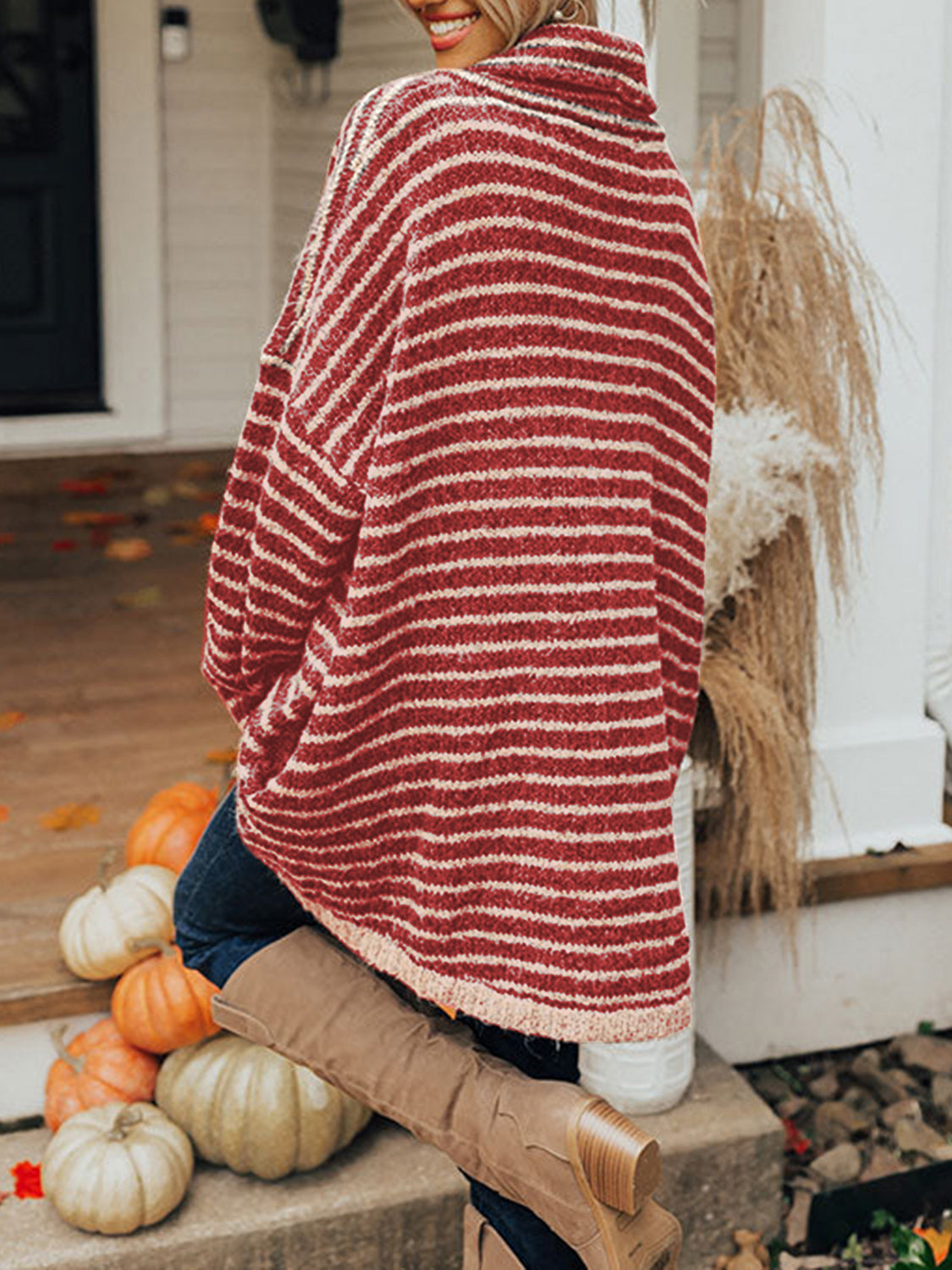 Oversized red and cream striped knit turtleneck sweater with slouchy fit and cowl neck.