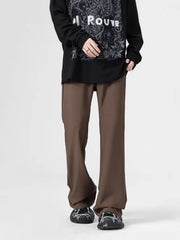 Men's relaxed fit coffee sweatpants with pockets, styled with a long sleeve graphic tee.