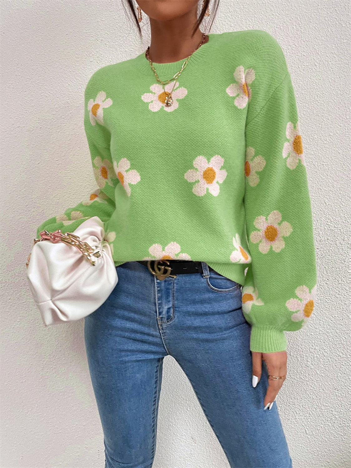 Mid Green knit sweater with puff sleeves and a white daisy floral print.