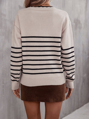 Beige striped knit sweater with black stripes and scalloped trim neckline.
