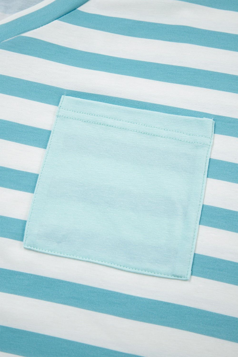 Striped t-shirt in teal and white with a contrasting light blue pocket.