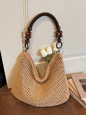 Khaki textured knit shoulder bag with beaded handle and dark brown strap.
