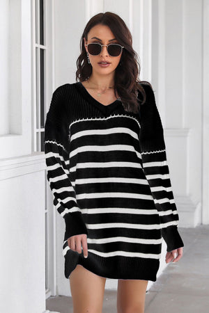 Black and white horizontal stripe knit mini dress with V-neck and long sleeves.