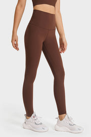 Brown high rise leggings with a seamless design and a v-shaped waistband.
