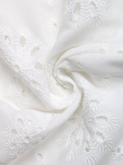 White eyelet embroidered button-up shirt with floral cutouts and breezy fabric.