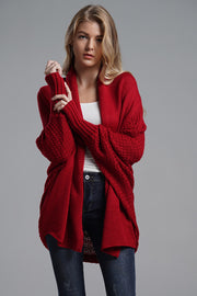Cocoon knit sleeve cardigan in deep red acrylic with a relaxed fit and textured sleeves.