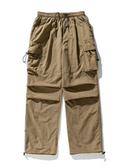 Khaki oversized utility cargo pants with multiple pockets and drawstring waist