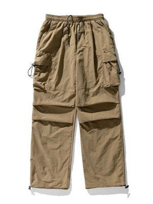 Khaki oversized utility cargo pants with multiple pockets and drawstring waist