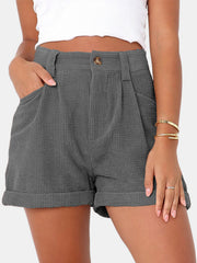 Dark Gray corduroy pleated high-waist shorts with buttoned front and cuffed hem.